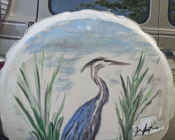 Lost my mom years ago. She still occasionally comes to me as a blue heron. Just painted this on my tired tire cover in her honour.