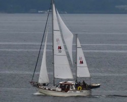 Motorsailing Genesis in her element close hauled making 8kts at1600rpm captured by 35mm telephoto voyeur from his shore residence!